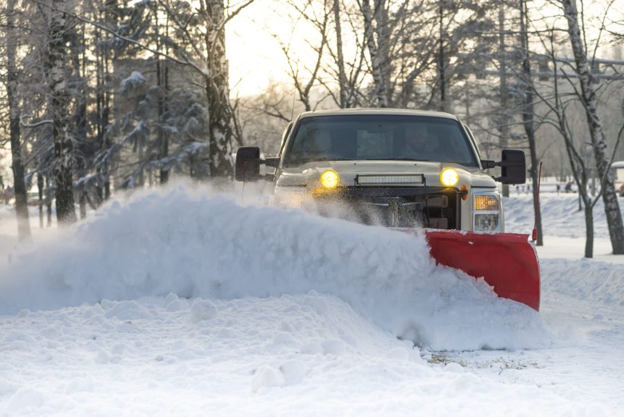 Snow plow doing snow removal after blizzard
